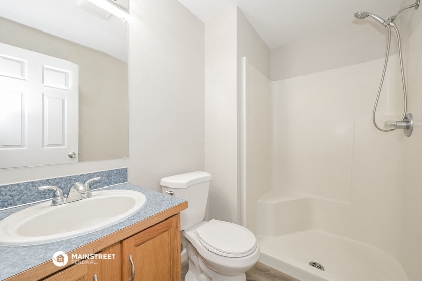 a bathroom with a sink toilet and a shower
