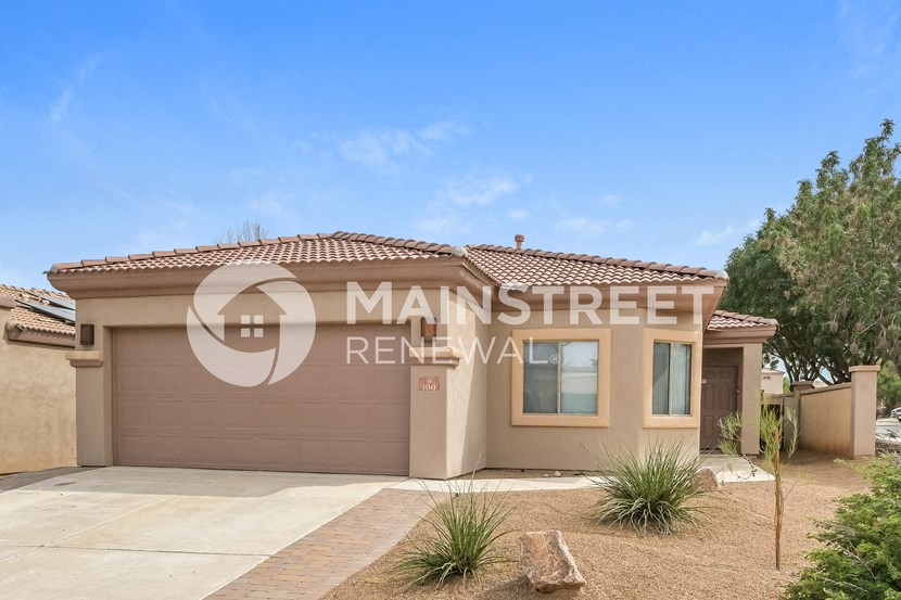 a new house with a garage and a driveway in front of it