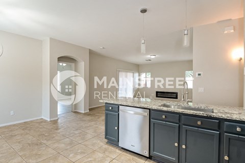 a kitchen with blue cabinets and a counter top
