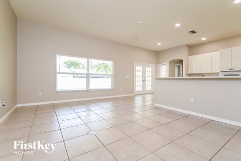 the kitchen and living room are spacious and clean