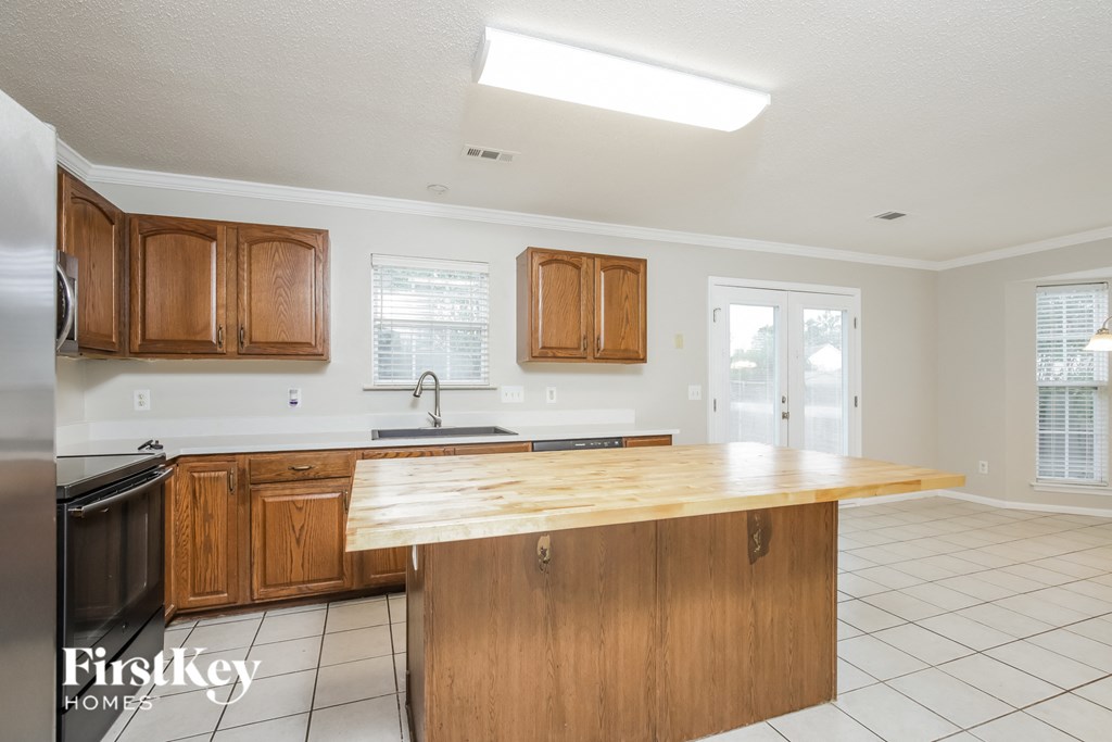 a kitchen with wood cabinets and a counter top