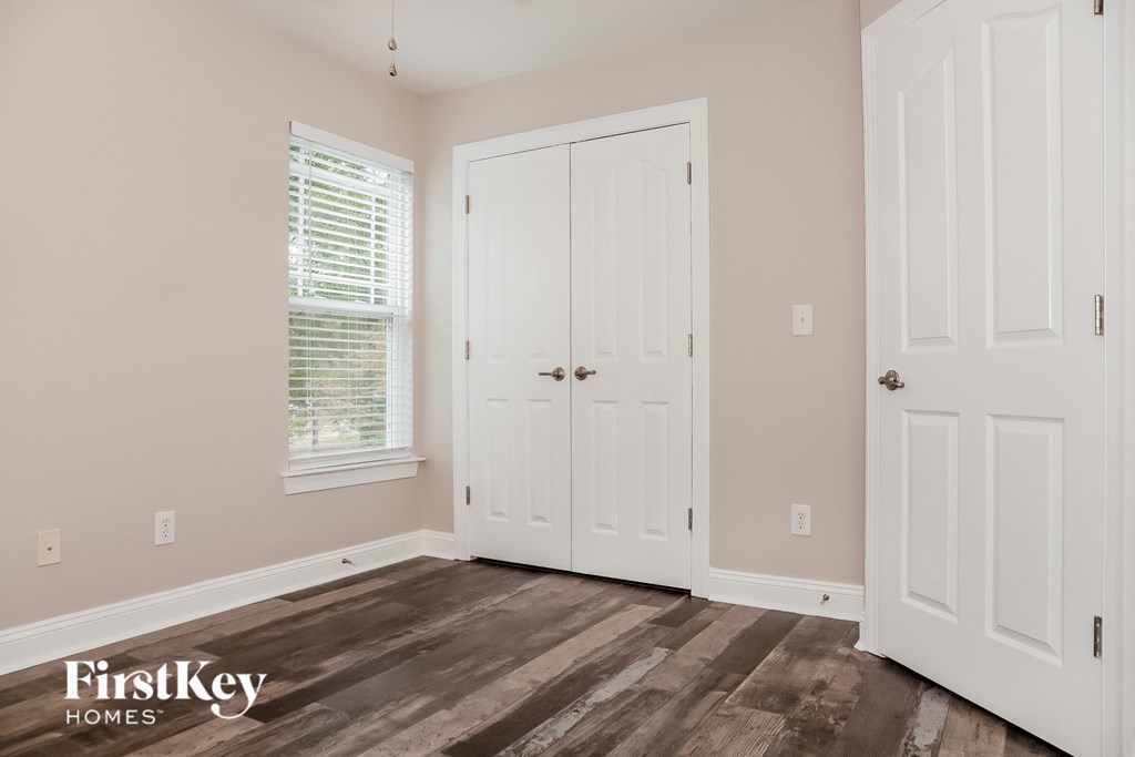 the second bedroom has a door to the closet and a window