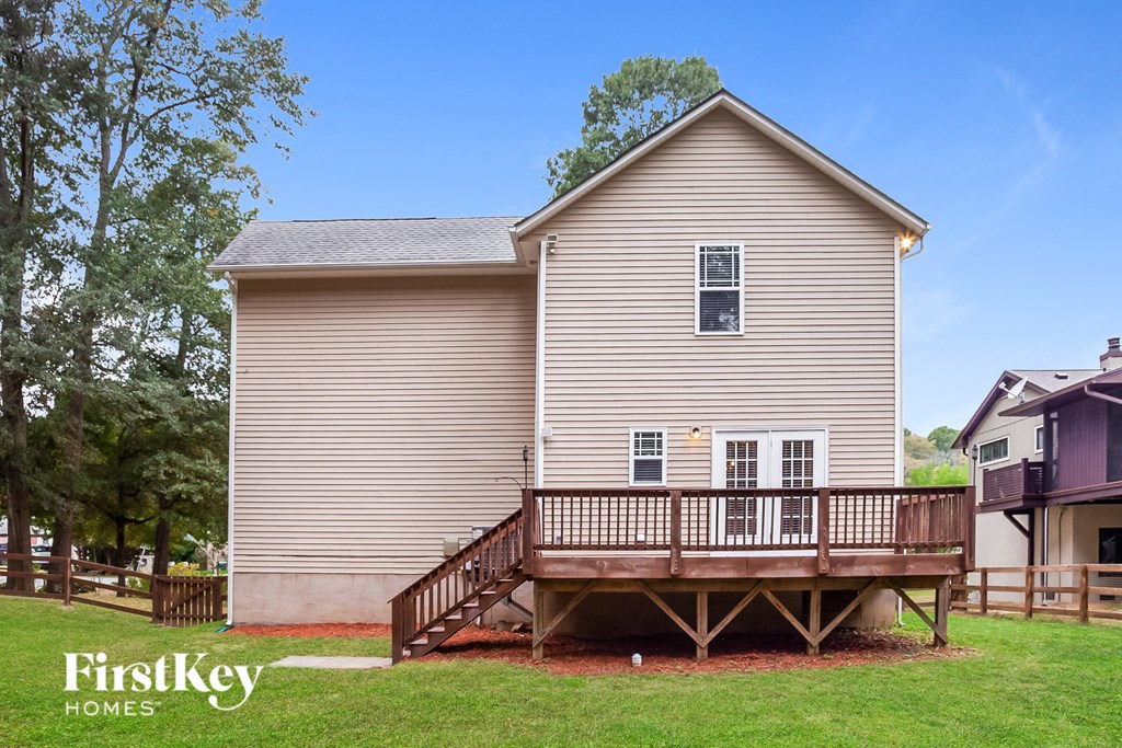 a house with a deck in front of it