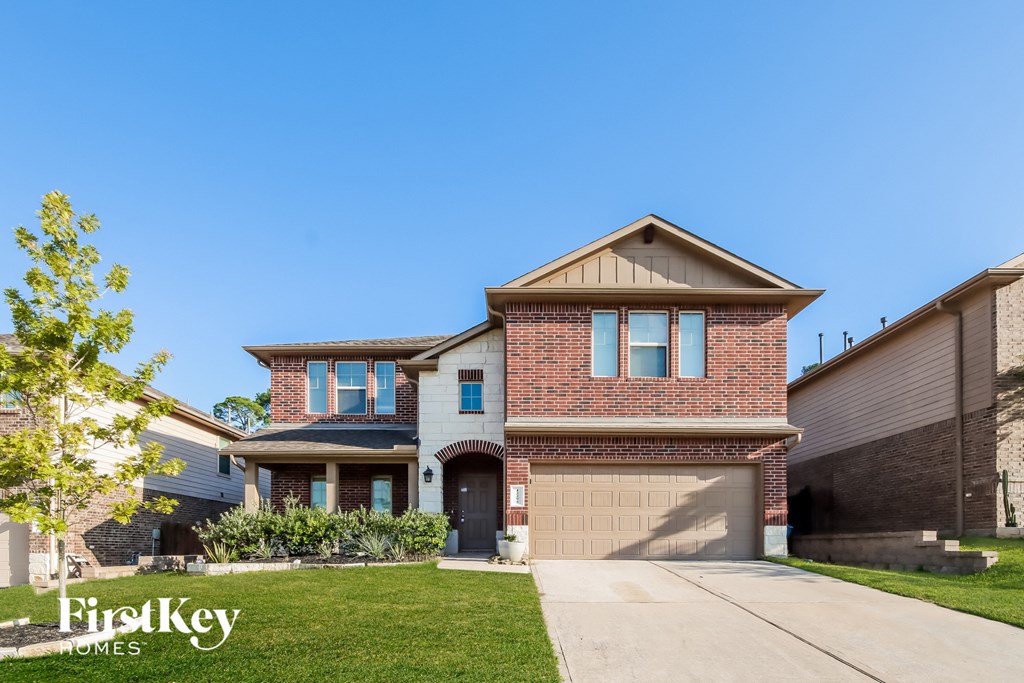 a house with a driveway and a garage door
