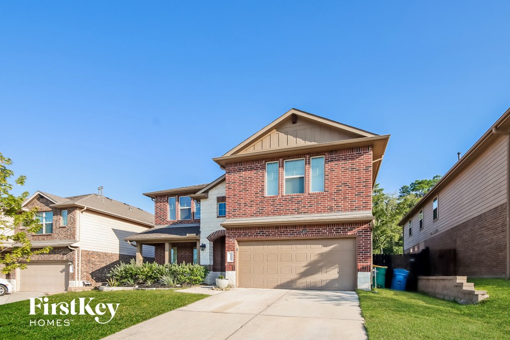 a house with a driveway and a garage door