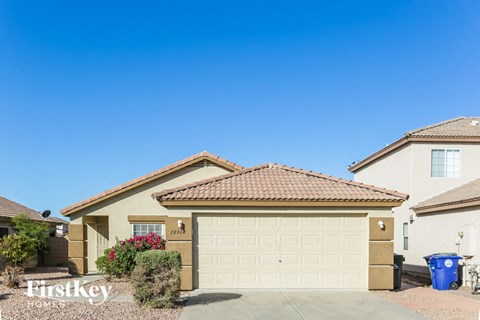 a house with a garage door in front of it