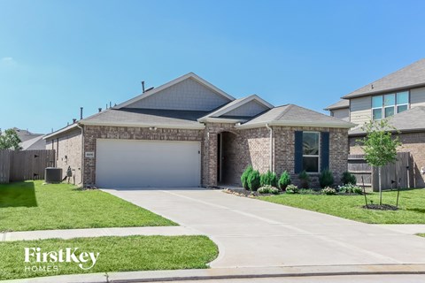 a house with a driveway and a garage door