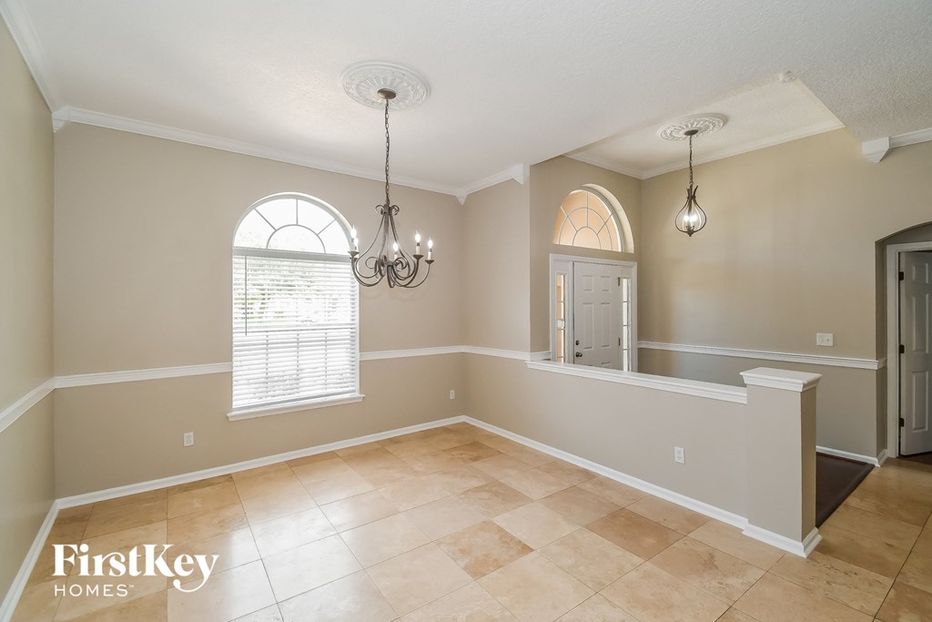 the dining room is open to the kitchen and living room