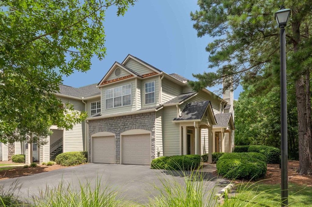 A house with a grey roof and a grey garage door.