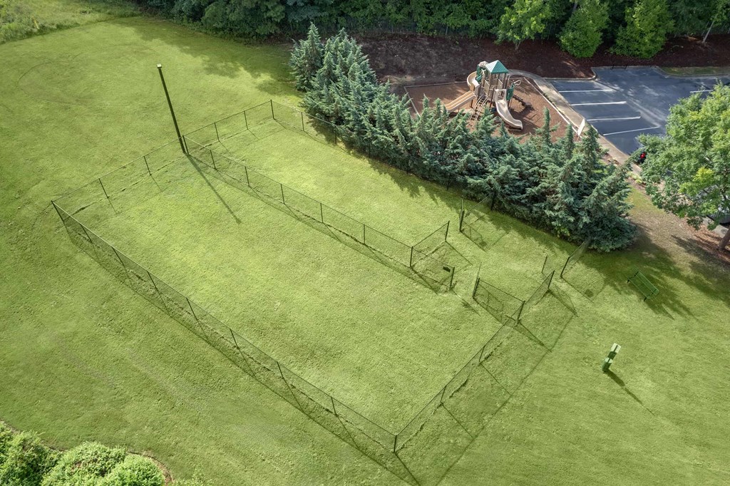 A large grassy field with a maze drawn on it.