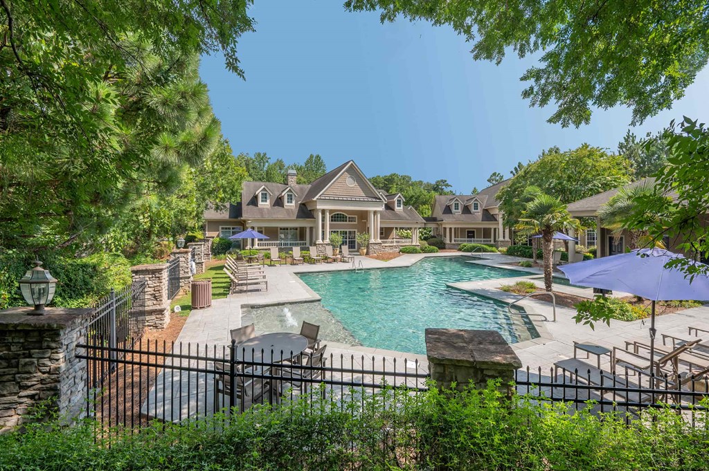 A large house with a pool in the backyard.