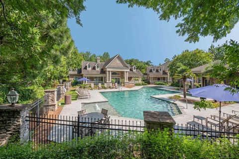 A large house with a pool in the backyard.