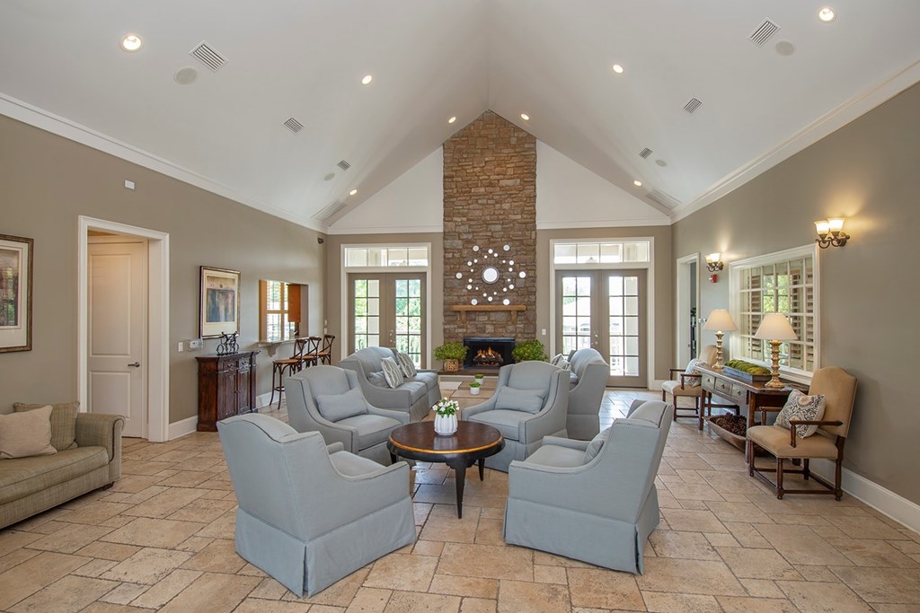 A living room with a fireplace and a brick chimney.
