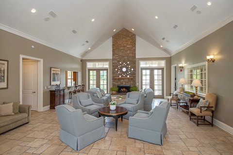 A living room with a fireplace and a brick chimney.