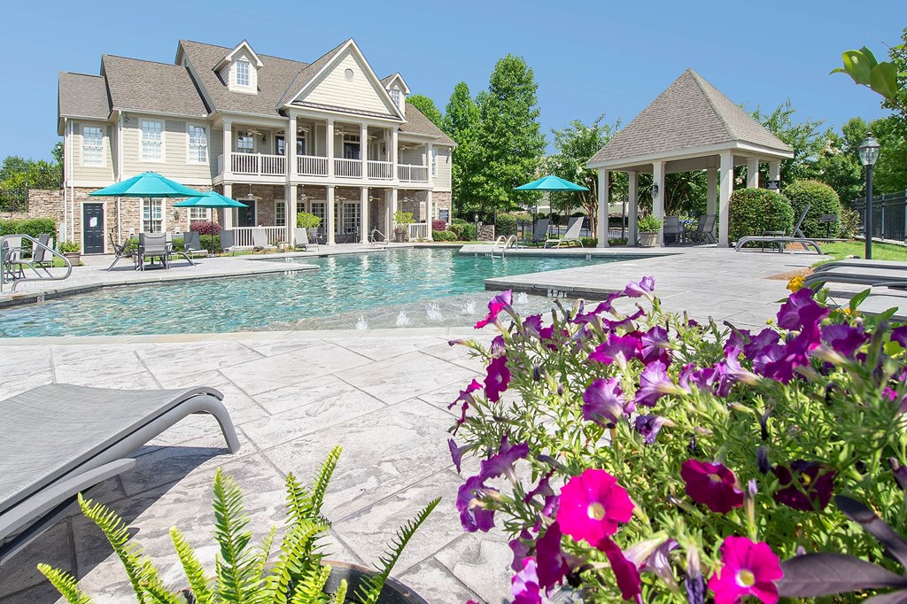 A large house with a pool and a gazebo.