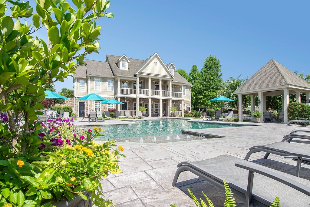 A large house with a pool in the backyard.