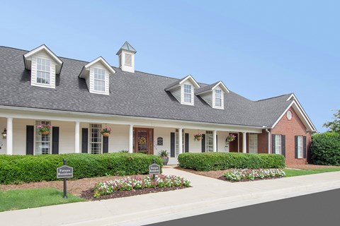 A house with a grey roof and white trim.