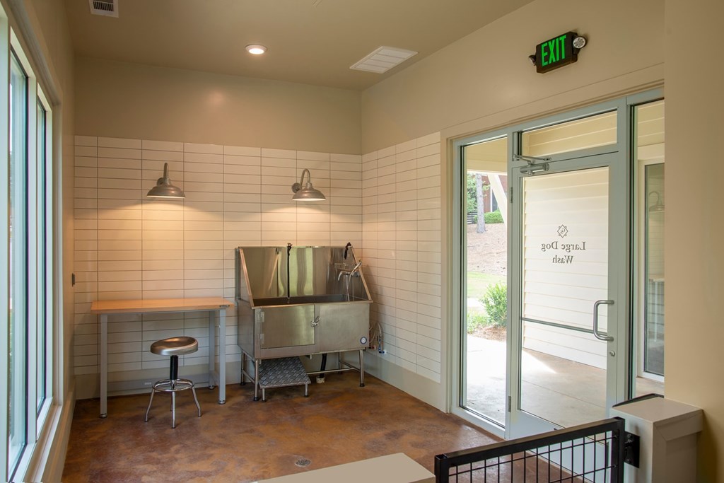A kitchen area with a table and two bar stools.