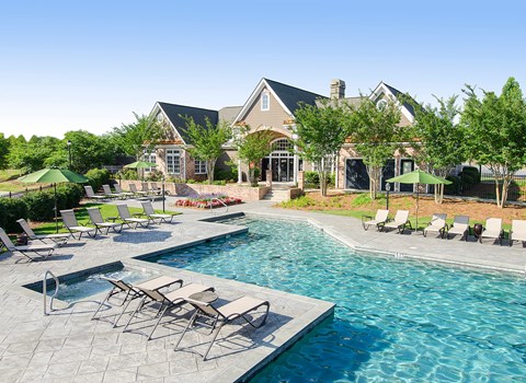 A large house with a pool in the backyard.