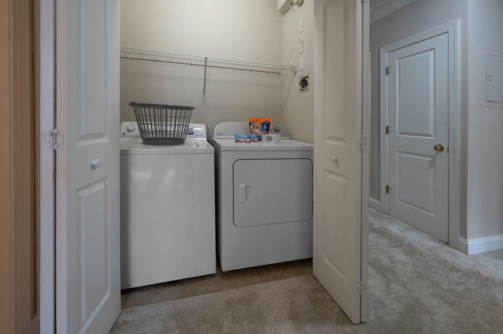 A laundry room with a washer and dryer.
