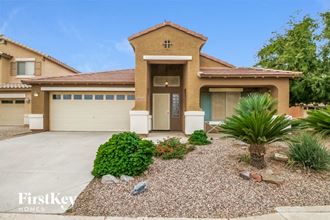 a home with a driveway and a garage door