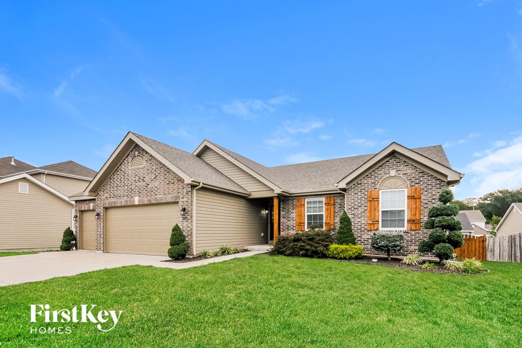 a home with a grassy lawn in front of it