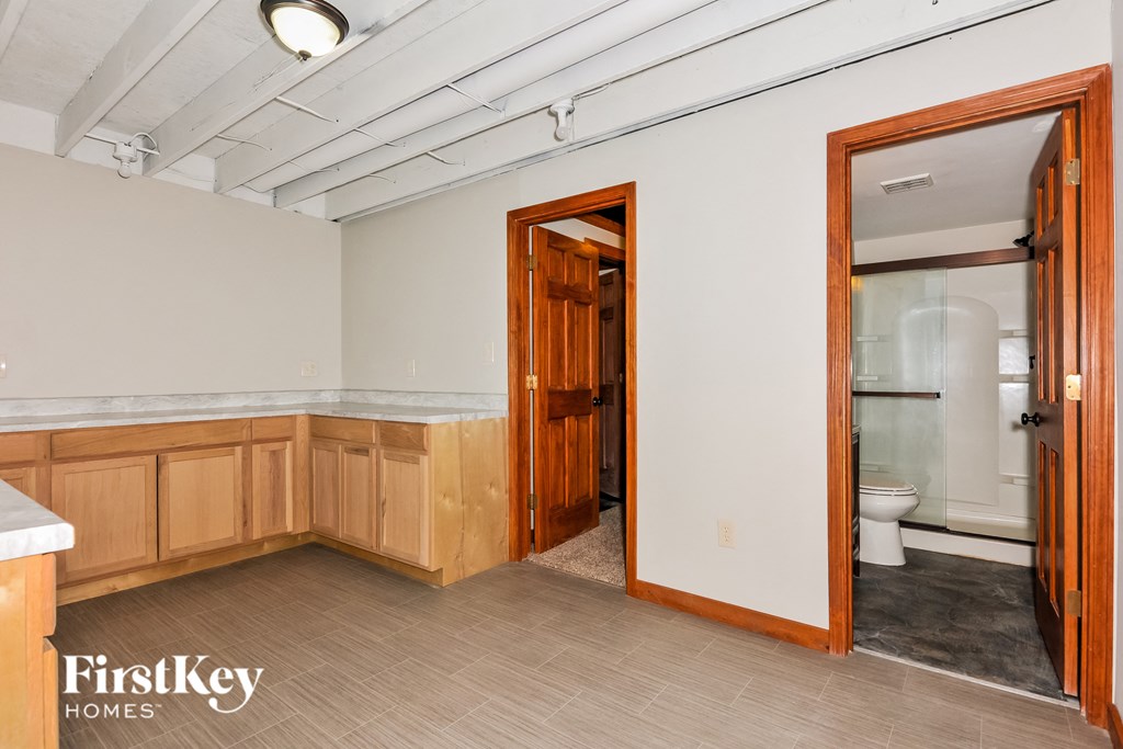 a bathroom with a toilet and a sink and a mirror