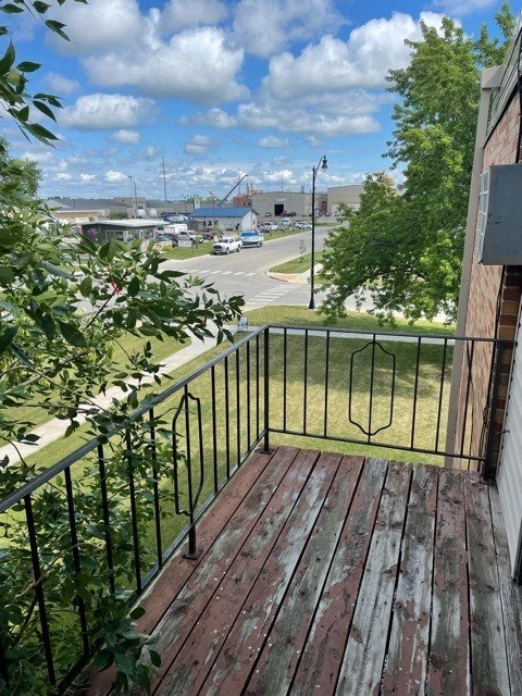 a balcony with a view of a harbor with boats