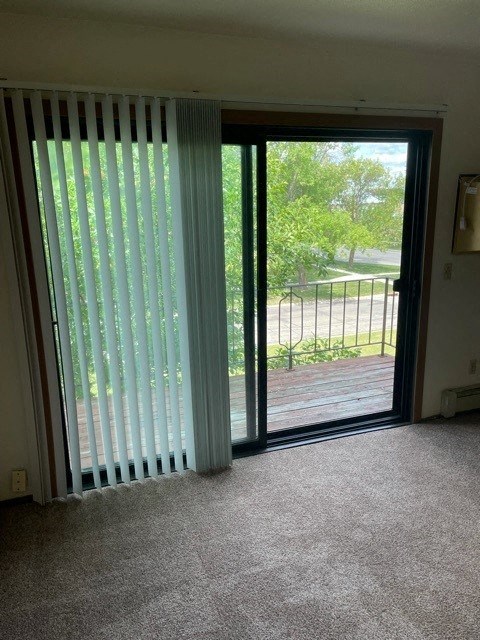 a living room with a sliding glass door