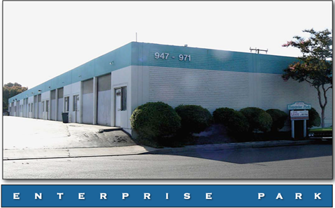 A long building with the numbers 947-971 on it.
