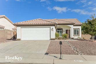 a home with a white garage door and a driveway