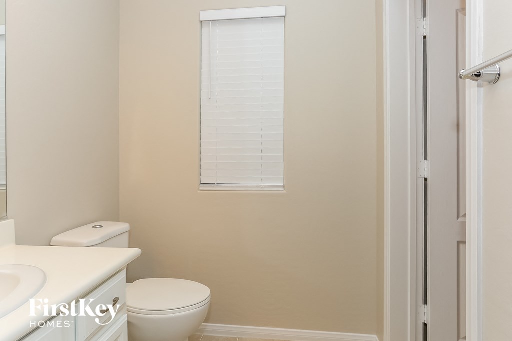 a small bathroom with a toilet and a shower