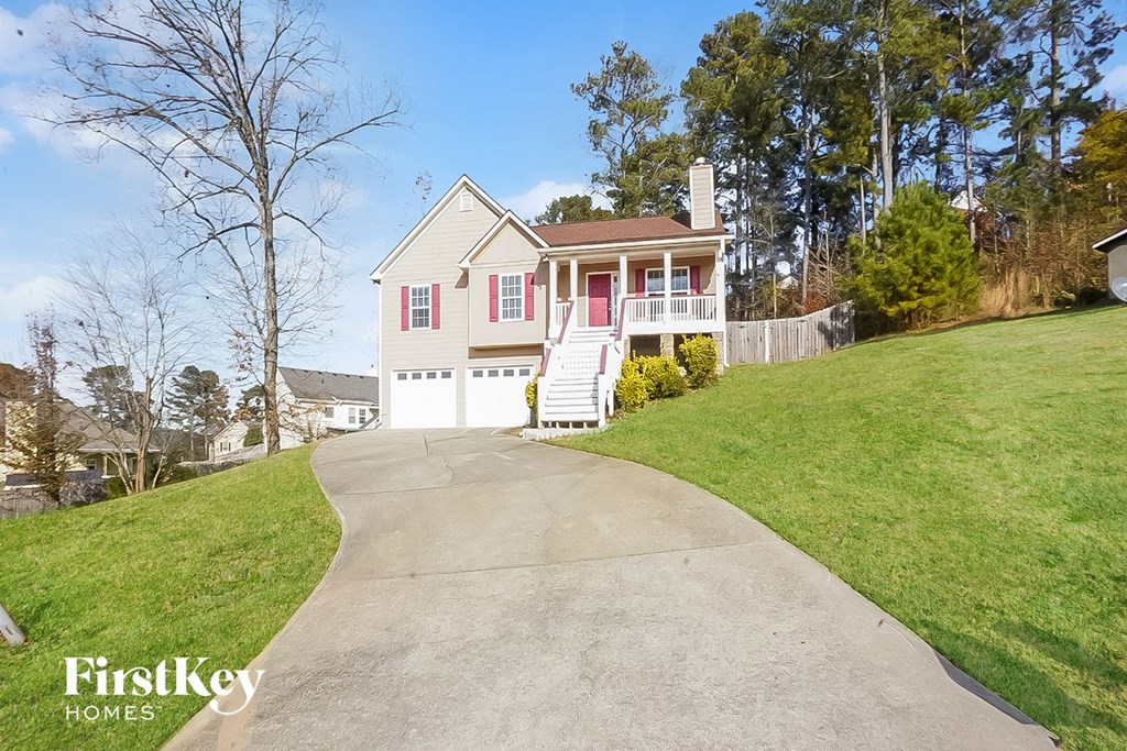 A house with a driveway in front of it.