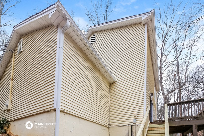 a view of the side of a house with siding