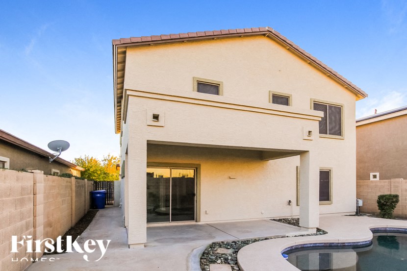 A house with a pool in the backyard.