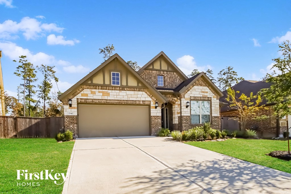 A house with a garage is for sale by FirstKey Homes.