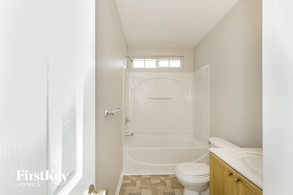 a small bathroom with a toilet and a shower