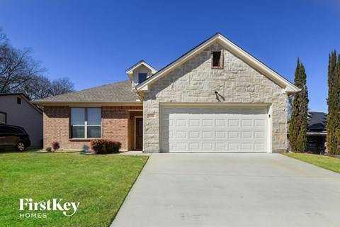 a brick house with a white garage door
