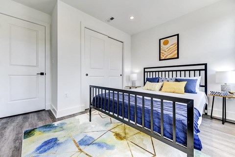 a bedroom with a bed and a closet