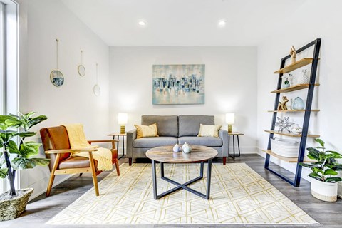 a living room with a couch and a table