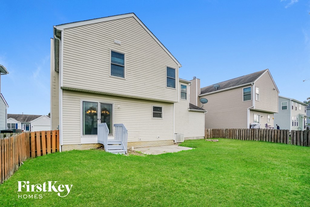 A house with a lawn in front of it.