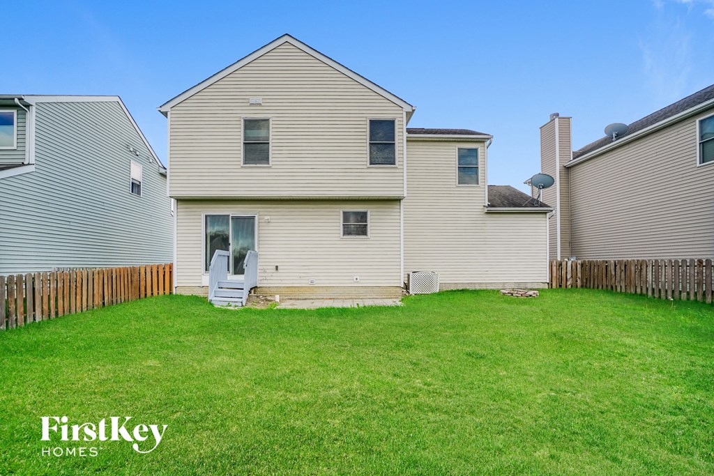 A house with a lawn in front of it is for sale.