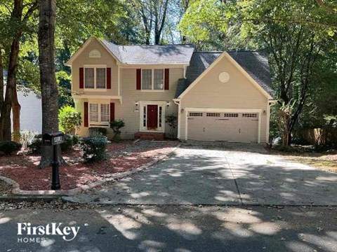 a house with a driveway and a garage door