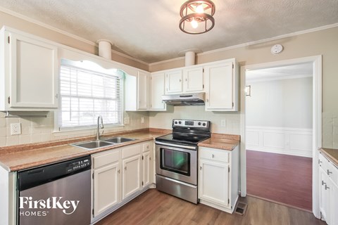 A kitchen with a FirstKey Homes sign on the dishwasher.