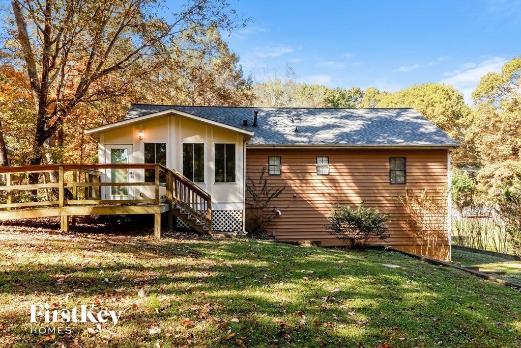 a small house with a porch and a deck