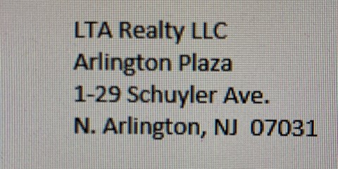 a sign that says lta really llc alliance plaza 1 230 schuyler