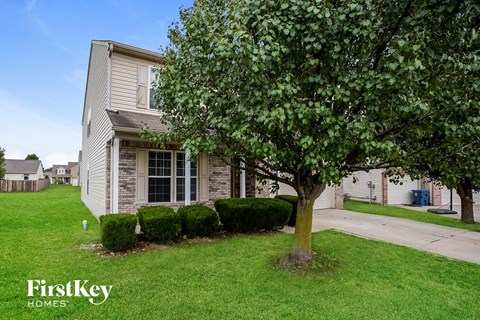 a house with a tree in front of it