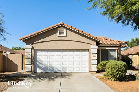 a house with a white garage door in front of it