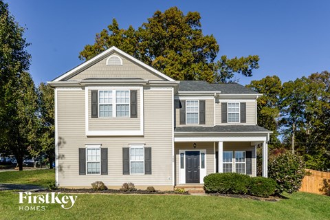 a house with a lawn in front of it