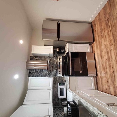 a view of the kitchen from above in a tiny house